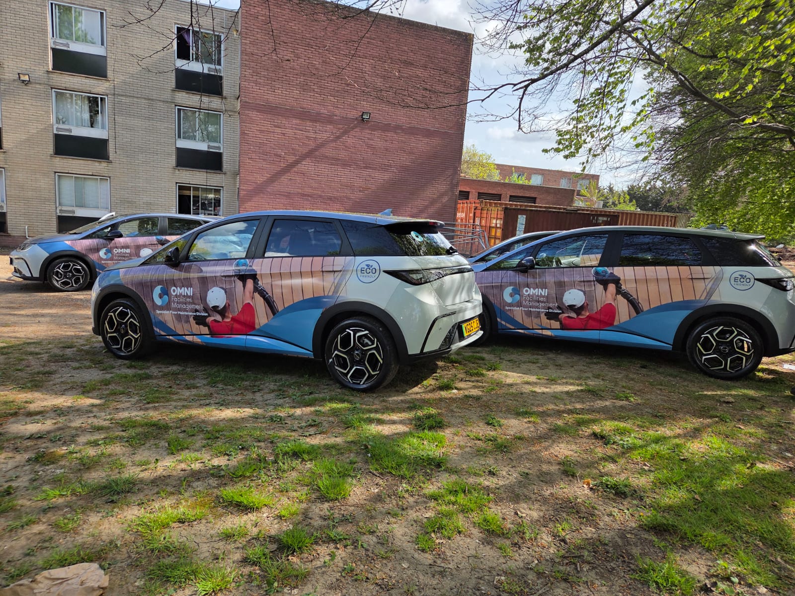 Two cars carrying matching branded fleet graphics