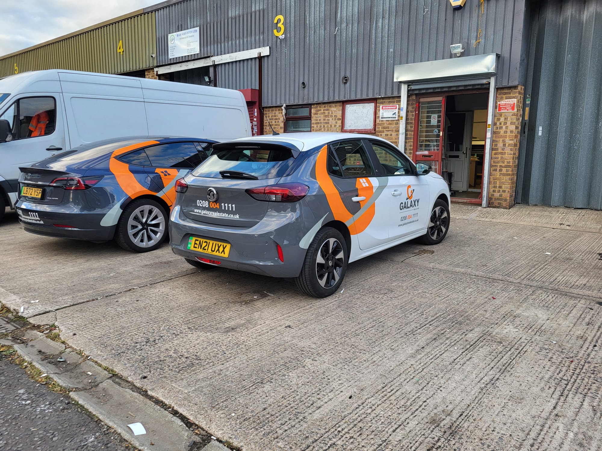 Fleet vehicles carrying matching branded graphics
