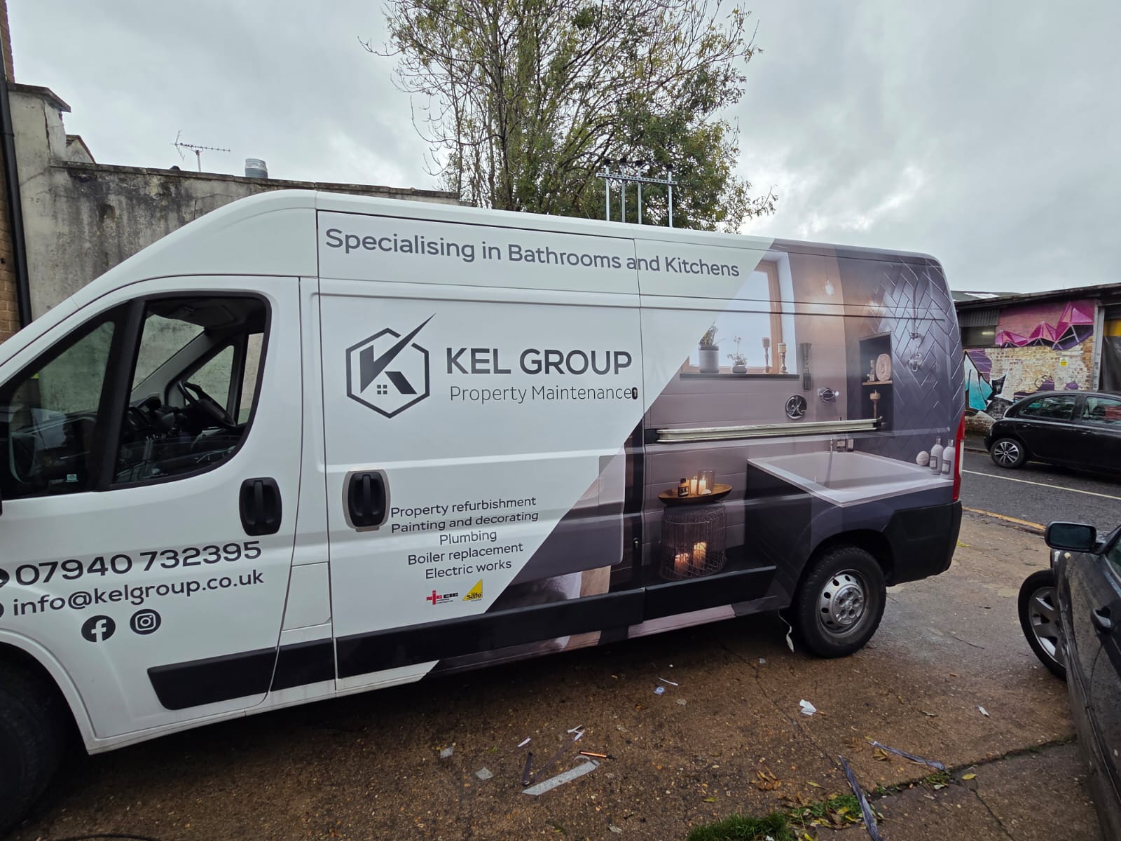 Large KEL Group van with bathroom image wrap and service list